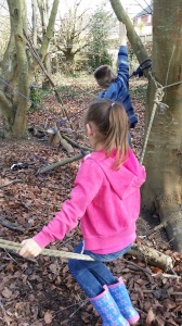 small child on swing made from rope, forest school, dorset