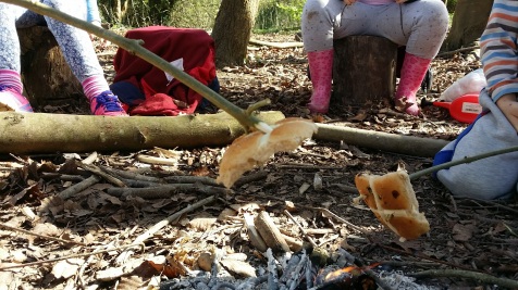 hot cross toasting at Forest school in Hampshire